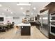 Open kitchen featuring stainless steel appliances, an island and a breakfast nook at 803 Bolide St, Las Vegas, NV 89138