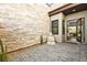 Tranquil patio area with decorative stone wall and a peaceful Buddha statue at 803 Bolide St, Las Vegas, NV 89138