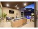 Stylish outdoor patio with comfortable seating, a barbecue grill, and access to the pool, creating a perfect entertainment space at 803 Bolide St, Las Vegas, NV 89138