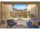 Inviting outdoor patio featuring comfortable seating, a built-in water feature, and a barbecue grill, perfect for relaxation at 803 Bolide St, Las Vegas, NV 89138