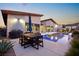 Beautiful pool area with outdoor dining and landscaping, perfect for relaxation and entertainment at 803 Bolide St, Las Vegas, NV 89138
