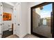 View of a modern powder room and the outdoor space beyond the glass doors at 803 Bolide St, Las Vegas, NV 89138