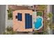Overhead view of a home featuring solar panels, a sparkling pool, and a well-maintained backyard at 820 Sandhill Sage St, Henderson, NV 89052