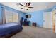 Bright bedroom with carpet, ceiling fan, a window with blinds, and plenty of space at 820 Sandhill Sage St, Henderson, NV 89052