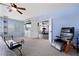 Spacious bedroom with a ceiling fan, built-in shelves and a work out area nearby at 820 Sandhill Sage St, Henderson, NV 89052