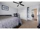 Bedroom featuring neutral walls, carpet flooring, closet, and access to the hallway at 820 Sandhill Sage St, Henderson, NV 89052