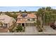 Attractive two-story home featuring a tile roof, attached garage, and a well-maintained front yard at 820 Sandhill Sage St, Henderson, NV 89052