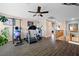 Second-story home gym with dark wood floors, ceiling fan, and exercise equipment at 820 Sandhill Sage St, Henderson, NV 89052