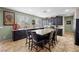 Well-lit kitchen boasts a central island with bar seating and modern finishes at 820 Sandhill Sage St, Henderson, NV 89052