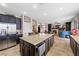 Spacious kitchen with granite island, stainless steel appliances, and open floor plan at 820 Sandhill Sage St, Henderson, NV 89052