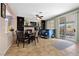 Open floor plan of dining area with fireplace, built-in shelves and sliding glass doors at 820 Sandhill Sage St, Henderson, NV 89052