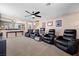 Home theater featuring reclining chairs, ceiling fan and carpeted floor at 820 Sandhill Sage St, Henderson, NV 89052