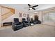 Home theater featuring reclining chairs, ceiling fan and carpeted floor at 820 Sandhill Sage St, Henderson, NV 89052