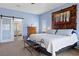 Bright main bedroom with a ceiling fan, sliding glass door to the ensuite bath, and carpet floors at 820 Sandhill Sage St, Henderson, NV 89052