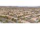 An aerial view of a sprawling neighborhood featuring desert landscaping and commercial areas at 820 Sandhill Sage St, Henderson, NV 89052