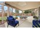 Inviting covered patio with comfortable seating, dining area, and a view of the sparkling pool at 820 Sandhill Sage St, Henderson, NV 89052
