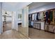 Spacious walk-in closet with mirrored doors, custom shelving, and a view to the bedroom at 820 Sandhill Sage St, Henderson, NV 89052