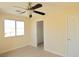 Bedroom featuring a ceiling fan, closet, and a window at 8237 New Leaf Ave, Las Vegas, NV 89131