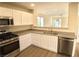 Kitchen with stainless steel appliances, granite countertops and wood floors at 8237 New Leaf Ave, Las Vegas, NV 89131