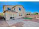 Beautiful backyard featuring paver patio, small patch of artificial grass, and desert landscaping at 8754 Moon Crater Ave, Las Vegas, NV 89178