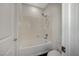 Clean bathroom featuring a shower-tub combo with white tiling and modern fixtures and a toilet at 8754 Moon Crater Ave, Las Vegas, NV 89178