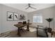 Cozy home office with wood desk, comfortable chair, and bright window for natural light at 8754 Moon Crater Ave, Las Vegas, NV 89178