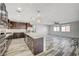 Expansive kitchen with a large island, stainless steel appliances, and seamless flow to the living areas at 8754 Moon Crater Ave, Las Vegas, NV 89178