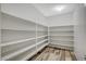 Spacious walk-in pantry with white shelving, providing ample storage space at 8754 Moon Crater Ave, Las Vegas, NV 89178