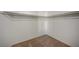 Spacious walk-in closet featuring carpeted floors and white shelving for maximum storage and organization at 8754 Moon Crater Ave, Las Vegas, NV 89178