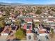 Wide aerial view of neighborhood featuring mature trees, single-Gathering homes, and desert landscaping at 8912 Dio Guardi Dr, Las Vegas, NV 89117