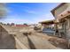 Large backyard with brick perimeter, hot tub, and covered patio at 8912 Dio Guardi Dr, Las Vegas, NV 89117