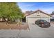 Charming home with a well-manicured front yard and a two-car garage at 8912 Dio Guardi Dr, Las Vegas, NV 89117
