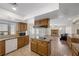 Open kitchen featuring granite countertops, stainless steel appliances, and seamless flow to the living area at 8912 Dio Guardi Dr, Las Vegas, NV 89117