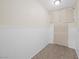Bright laundry room featuring a neutral color scheme, cabinets, and closet at 8912 Dio Guardi Dr, Las Vegas, NV 89117
