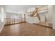 Spacious living room showcases beautiful wood floors and staircase with traditional wood banisters at 8912 Dio Guardi Dr, Las Vegas, NV 89117