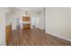 Open-concept living room with wood flooring, a staircase and natural light at 8912 Dio Guardi Dr, Las Vegas, NV 89117