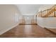 Living room features wood floors, and staircase with wood banisters, for an inviting atmosphere at 8912 Dio Guardi Dr, Las Vegas, NV 89117