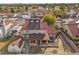 Backyard view showcasing red tile roof, covered patio with hot tub, stucco walls, and desert landscaping at 8912 Dio Guardi Dr, Las Vegas, NV 89117