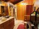 A rustic bathroom features wood paneling, floral accents, and a double vanity at , Mount Charleston, NV 89124