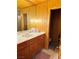 The bathroom is equipped with wood cabinets, modern lighting and plenty of storage at , Mount Charleston, NV 89124