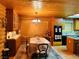 Wooden kitchen featuring a rustic chandelier, a large window and modern appliances at , Mount Charleston, NV 89124