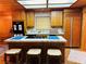 The kitchen features a center island, custom wood cabinetry, and modern appliances at , Mount Charleston, NV 89124