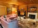 The living room offers wood walls, comfortable seating, and decorative accents at , Mount Charleston, NV 89124