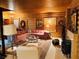 Cozy living room features wood walls, plush seating, and a vintage fireplace at , Mount Charleston, NV 89124