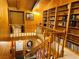 Interior shot showing open floor plan with wood paneling and built-in bookshelves creating a library space at , Mount Charleston, NV 89124