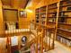 Interior shot showing open floor plan with wood paneling and built-in bookshelves creating a library space at , Mount Charleston, NV 89124