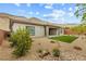 The backyard features a covered patio, low maintenance desert landscaping and mountain views at 10016 Copper Edge Rd, Las Vegas, NV 89148