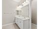 Bright bathroom featuring a double sink vanity, modern lighting, and ample counter space at 10016 Copper Edge Rd, Las Vegas, NV 89148