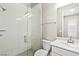 Bathroom featuring tiled shower with glass door, vanity, and tiled floor at 10016 Copper Edge Rd, Las Vegas, NV 89148