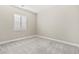Bedroom with neutral walls, carpet and window with white shutters allowing for natural light at 10016 Copper Edge Rd, Las Vegas, NV 89148